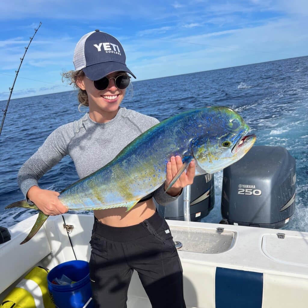 Shelby Welton catching a fish