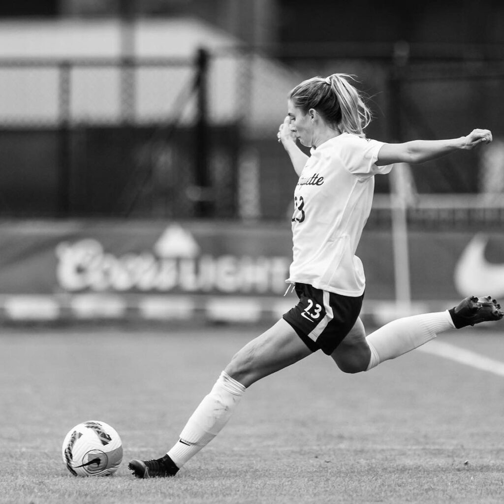 Rachel Johnson playing soccer