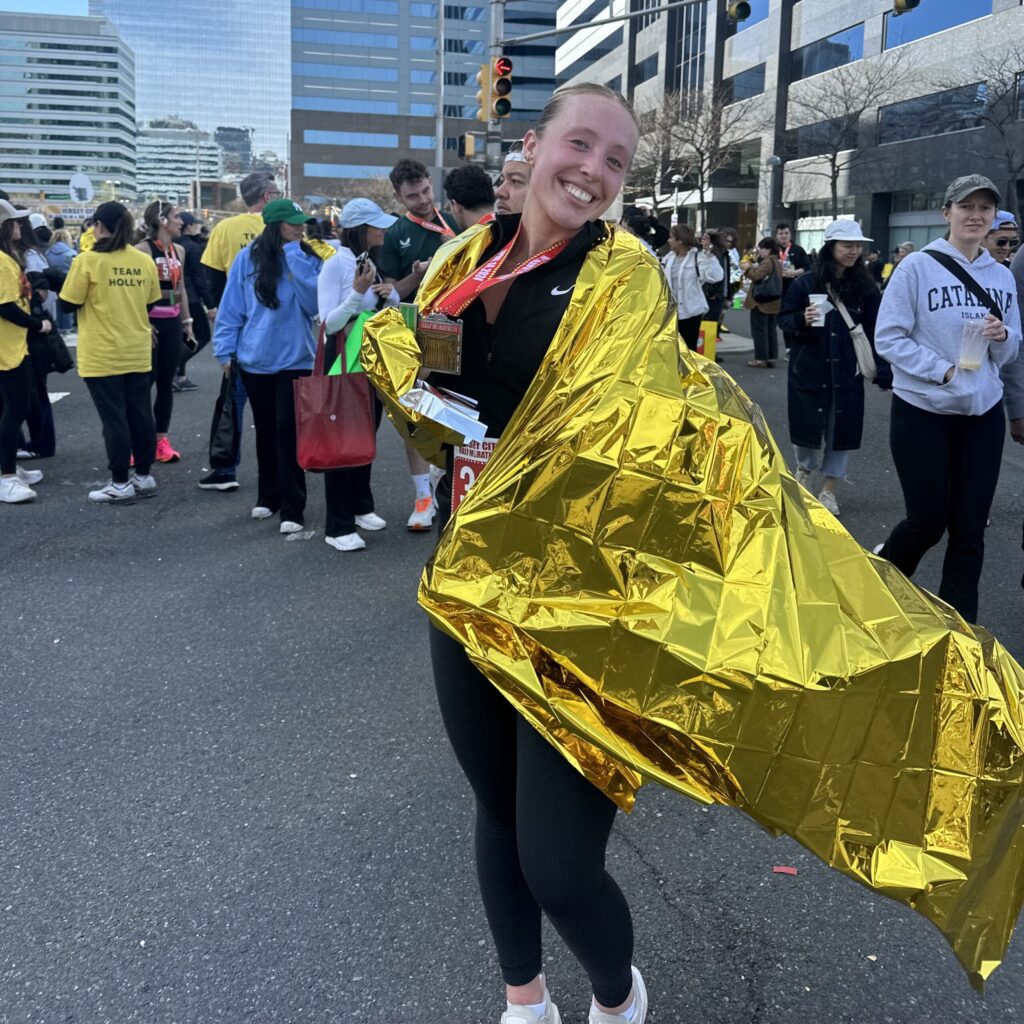 Danielle Freund celebrating finishing a race