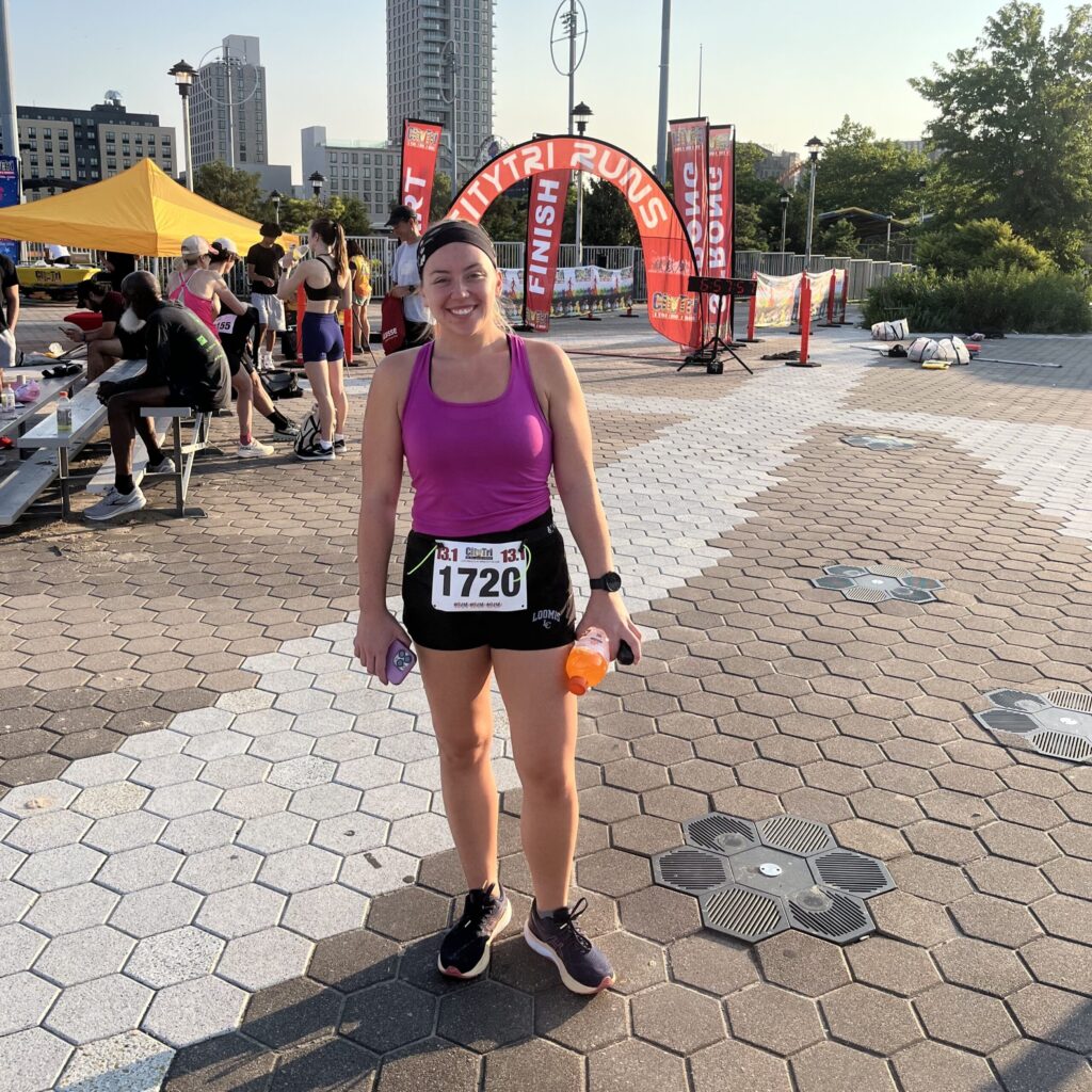 Emily Favreau at the finish line of a marathon