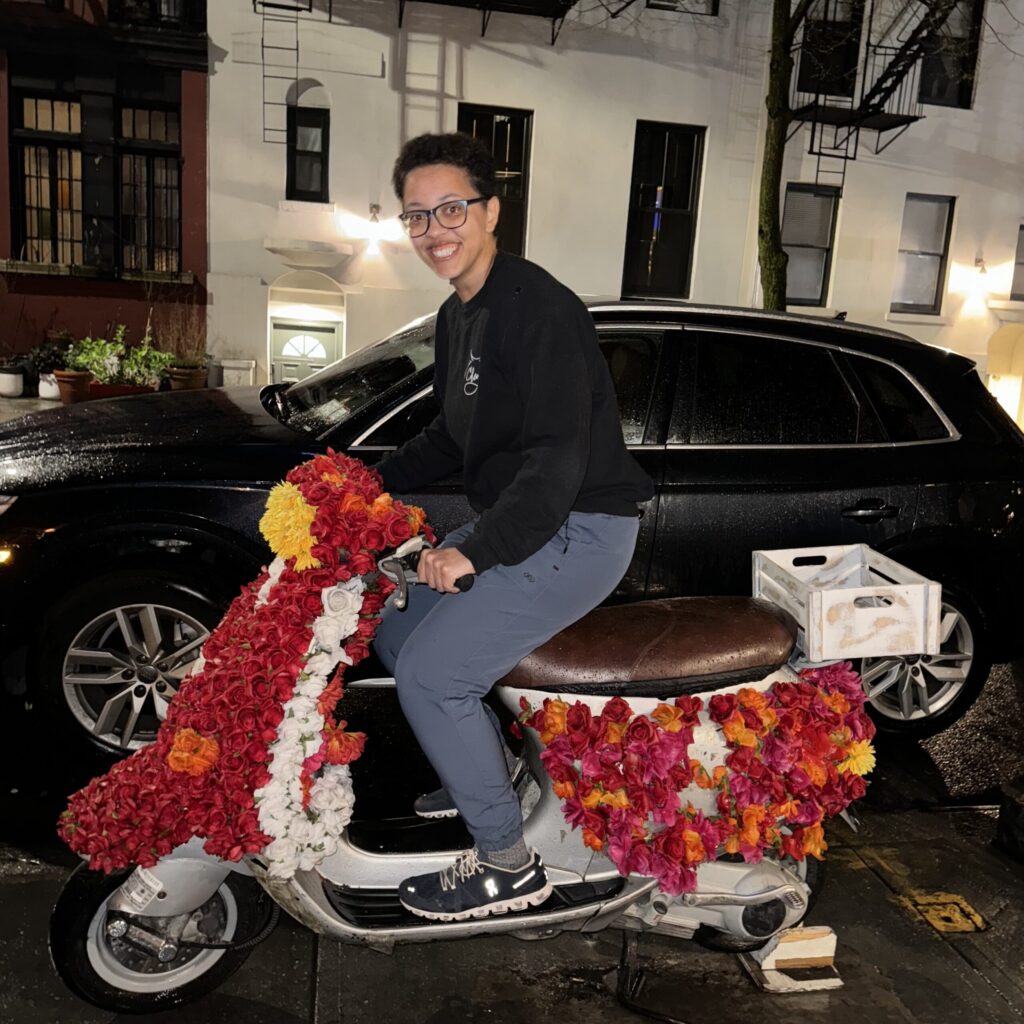 Haley Williams on a flower decorated motorcycle