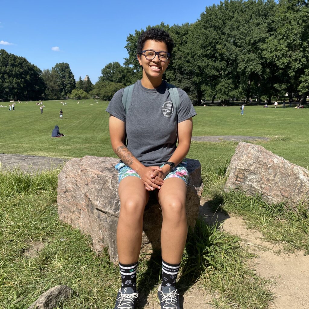 Haley Williams sitting on a rock