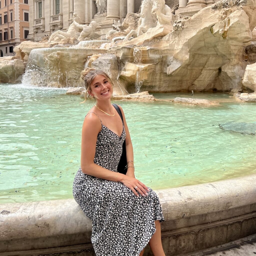 Rachel Johnson sitting on a fountain