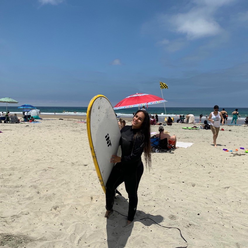 Laura Gonzalez surfing at the beach