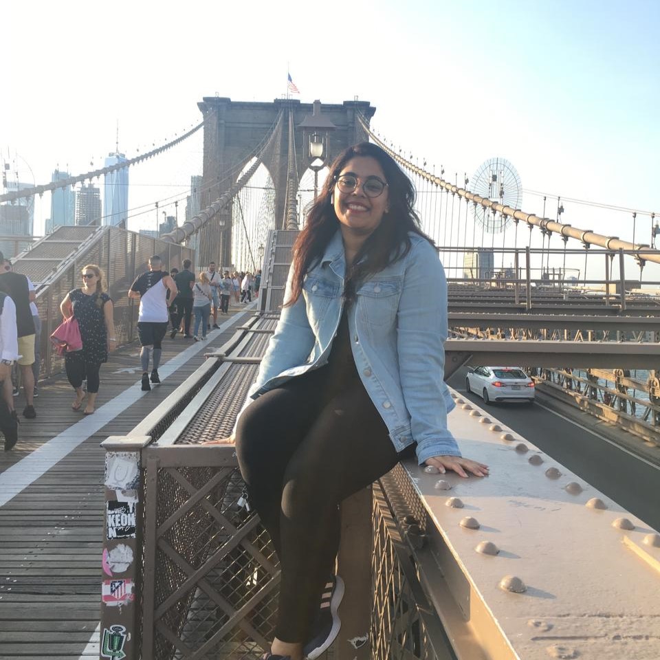 Megha Padhiar sitting on a bridge