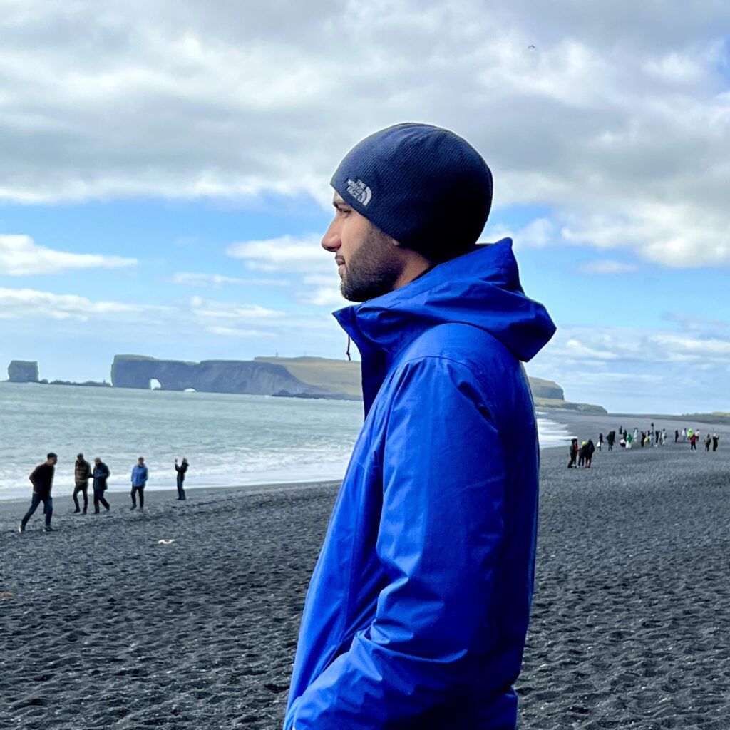 Philippe Corbanese standing on the beach