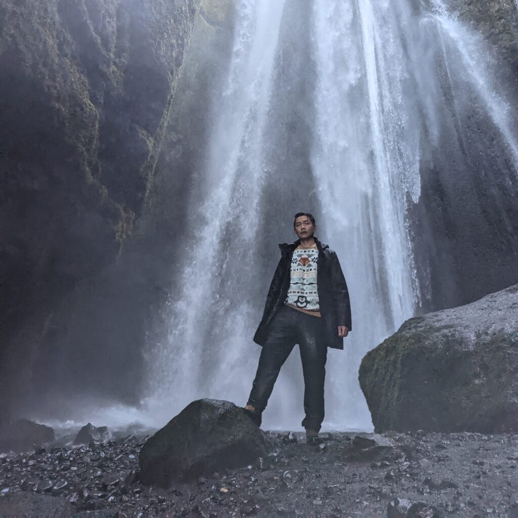 Rafael Gaerlan underneath a waterfall