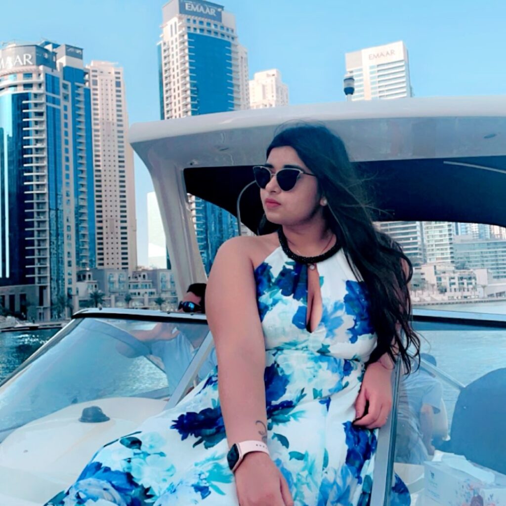 Riya Rajdev lounging on a boat