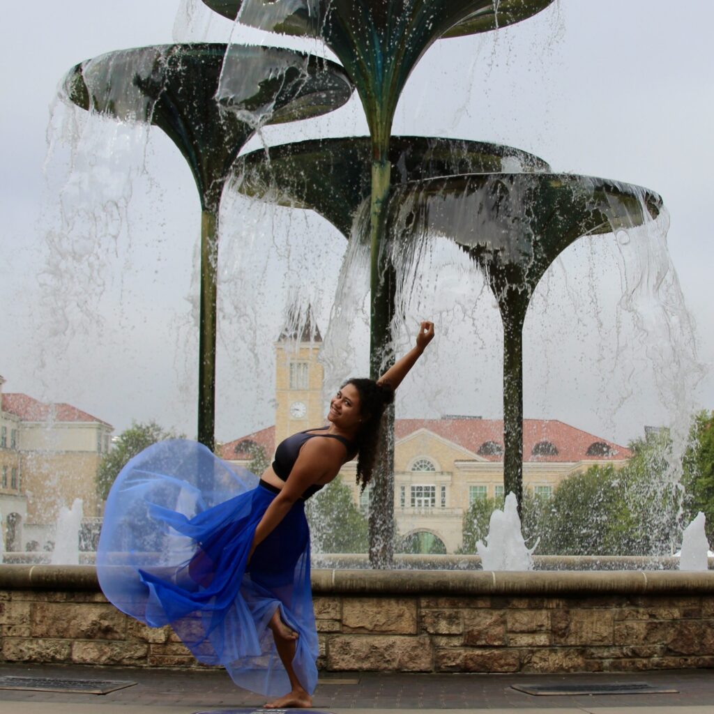 Suzanne Roudebush posing in a water fountain