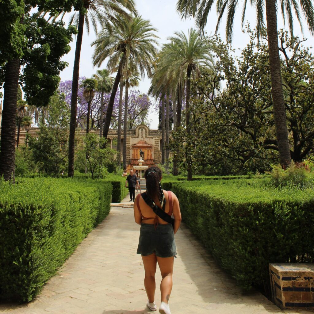 Suzanne Roudebush walking down a path of trees